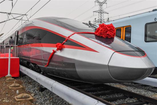 A new type of high-speed train is rolled out at CRRC Changchun Railway Vehicles Co Ltd on Wednesday.