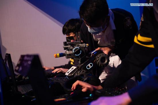 Contestants take part in the RoboMaster 2020 Youth Tournament in Macao, south China on Oct. 21, 2020. A total of 18 teams from 10 middle schools participated in the robotics competition here on Wednesday. (Xinhua/Cheong Kam Ka)