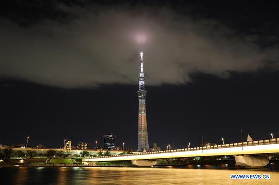 Tokyo Skytree is illuminated with a color symbolizing one of the Sustainable Development Goals (SDGs), as a part of a lighting pattern specially designed in the 17 colors of SDGs in Tokyo, Japan, Oct. 24, 2020. This special illumination of Skytree, designed to boost momentum toward achieving SDGs and to commemorate the 75th anniversary of the UN, will continue till Oct. 28, 2020. (Photo by Lyu Tianze/Xinhua) 