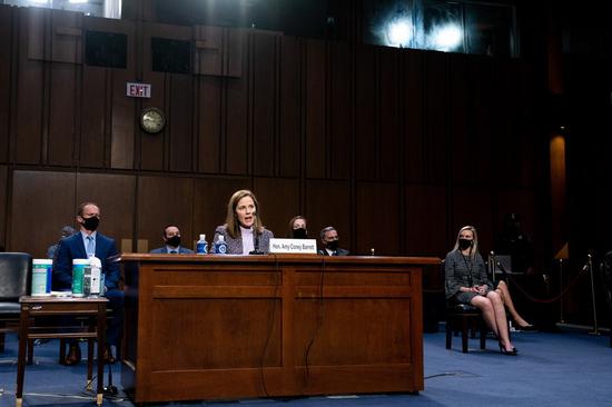 U.S. Supreme Court nominee Amy Coney Barrett (Front) attends her confirmation hearing before the Senate Judiciary Committee on Capitol Hill in Washington, D.C., the United States, on Oct. 14, 2020. (Anna Moneymaker/Pool via Xinhua)