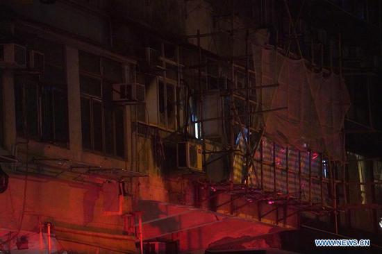 Photo taken on Nov. 15, 2020 shows a fire scene in Hong Kong, south China. Seven people were killed and more than 10 others were injured after a fire broke out at a tenement building in Hong Kong on Sunday night, the police said. The fire, which occurred around 8 p.m. local time at the building along the Canton Road, Jordan, was extinguished about two hours later. (Xinhua/Lui Siu Wai)