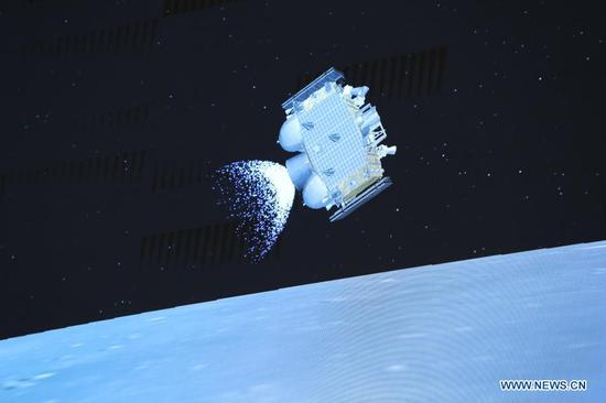 Photo taken at Beijing Aerospace Control Center (BACC) in Beijing on Dec. 3, 2020 shows the ascender of Chang'e-5 spacecraft flying above the lunar surface. The Chinese spacecraft carrying the country's first lunar samples blasted off from the moon late Thursday, the China National Space Administration announced. This represented the first-ever Chinese spacecraft to take off from an extraterrestrial body. (Xinhua/Jin Liwang)
