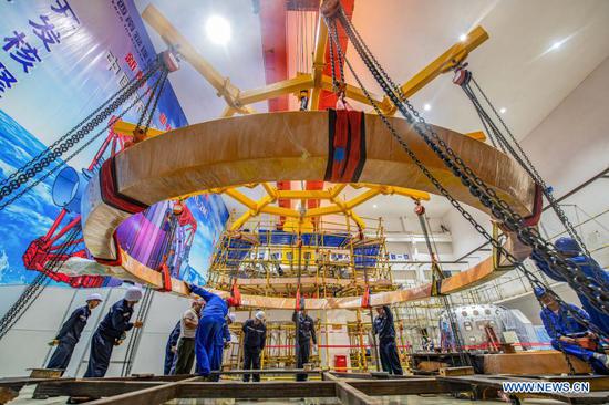 File photo taken on Sep. 16, 2019 shows staff members of China National Nuclear Corporation (CNNC) Southwestern Institute of Physics working at the installation site of the HL-2M Tokamak, China's new-generation 