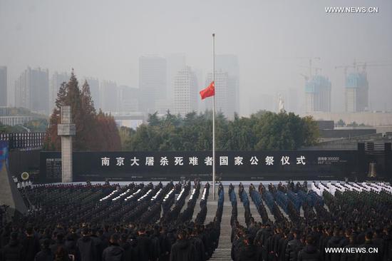 Photo taken on Dec. 13, 2020 shows the national memorial ceremony for the Nanjing Massacre victims at the Memorial Hall of the Victims of the Nanjing Massacre by Japanese Invaders in Nanjing, capital of east China's Jiangsu Province. (Xinhua/Ji Chunpeng)