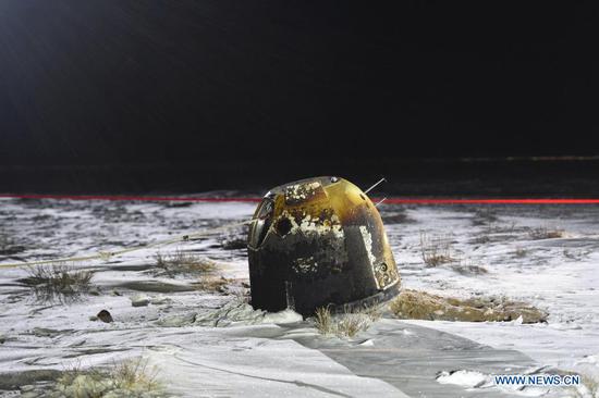 Photo taken on Dec. 17, 2020 shows the return capsule of China's Chang'e-5 probe in Siziwang Banner, north China's Inner Mongolia Autonomous Region. The return capsule of China's Chang'e-5 probe touched down on Earth in the early hours of Thursday, bringing back the country's first samples collected from the moon, as well as the world's freshest lunar samples in over 40 years. (Xinhua/Lian Zhen)