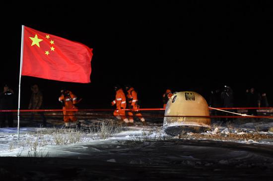 The return capsule of China's Chang'e-5 probe lands in Siziwang Banner, north China's Inner Mongolia Autonomous Region, on Dec. 17, 2020. (Xinhua/Lian Zhen)