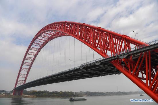 Photo taken on Dec. 28, 2020 shows a view of the Third Pingnan Bridge in Pingnan County, Guigang City of south China's Guangxi Zhuang Autonomous Region. With a length of 1,035 meters, the bridge, whose construction started from June of 2018, was completed and opened to traffic on Monday. (Xinhua/Cao Yiming)