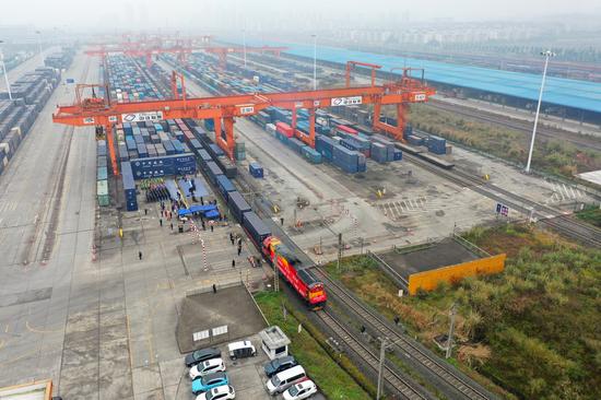 Aerial photo shows a China-Europe freight train bound for Duisburg of Germany departing from Tuanjiecun Railway Station in southwest China's Chongqing, Jan. 1, 2021. (Xinhua/Tang Yi)