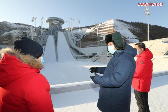 Chinese President Xi Jinping, also general secretary of the Communist Party of China Central Committee and chairman of the Central Military Commission, inspects the National Ski Jumping Center in Zhangjiakou, north China's Hebei Province, Jan. 19, 2021. (Xinhua/Ju Peng)