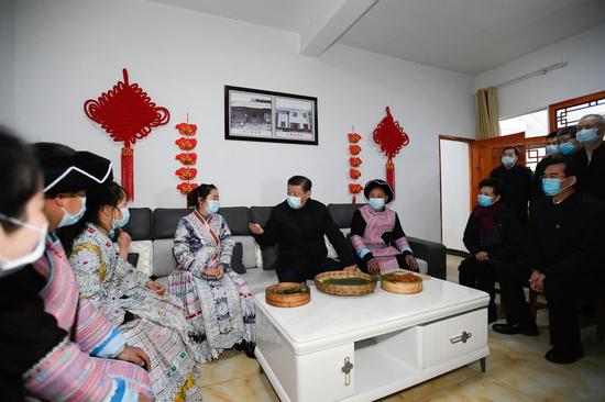 Chinese President Xi Jinping, also general secretary of the Communist Party of China Central Committee and chairman of the Central Military Commission, visits villagers of Huawu Village, Xinren Miao Township of Qianxi County, Bijie, southwest China's Guizhou Province, Feb. 3, 2021. (Xinhua/Li Xueren)