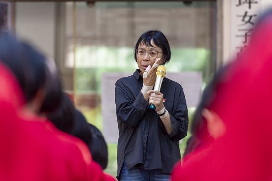 Zhang Guimei weeps during a lecture at the Huaping Senior High School for Girls in Lijiang, southwest China's Yunnan Province, Sept. 5, 2020. Zhang is the principal of the Huaping Senior High School for Girls, the country's first public high school that provides free education for female students, in the city of Lijiang. Zhang has been educating and aiding students in need, most living in isolated and poor areas. The school, led by Zhang, has created a miracle for the girls: 1,804 graduates have been admitted to colleges. (Xinhua/Chen Xinbo)