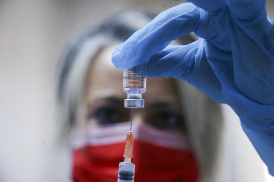 A medical worker prepares a dose of China's Sinovac COVID-19 vaccine at the Sabiha Uzun Maternal Child Health Center in Ankara, Turkey, on Jan. 15, 2021. (Photo by Mustafa Kaya/Xinhua)