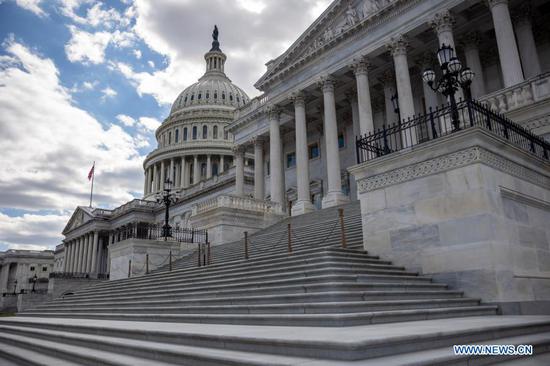 Photo taken on March 6, 2021 shows the U.S. Capitol building in Washington, D.C., the United States. The evenly split U.S. Senate on Saturday narrowly passed a 1.9-trillion-U.S.-dollar COVID-19 relief bill after a marathon overnight session that continued until midday, with lawmakers voting along party lines. (Photo by Ting Shen/Xinhua)