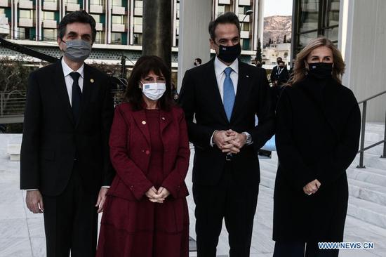 Greek President Katerina Sakellaropoulou (2nd L) and Greek Prime Minister Kyriakos Mitsotakis (2nd R) pose at the renovated National Gallery in Athens, Greece, on March 24, 2021. Greece's renovated National Gallery in Athens reopened on Wednesday in time for the 200th anniversary of the start of the Greek War of Independence against Ottoman rule, which will be celebrated on Thursday. (Tatiana Bolari/Eurokinissi/Pool via Xinhua)