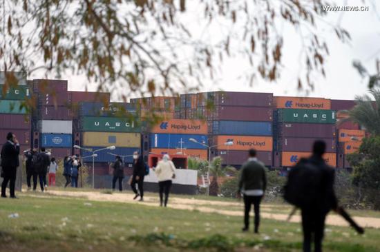 Photo taken on March 30, 2021 shows a ship sailing on the Suez Canal, Egypt. At least 113 container ships have passed through the Suez Canal that was blocked by a massive cargo container, chairman of the Suez Canal Authority (SCA) Osama Rabie said on Tuesday. (Xinhua/Ahmed Gomaa)