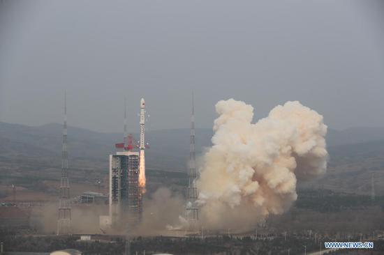 A Long March-4B carrier rocket carrying a satellite, the third of the Shiyan-6 series, blasts off from the Taiyuan Satellite Launch Center in north China's Shanxi Province on April 9, 2021. China successfully sent the experiment satellite into planned orbit Friday. (Photo by Zheng Taotao/Xinhua)