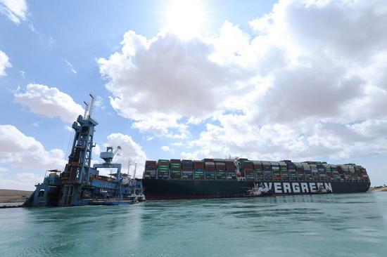 Rescue vessels work at the site of a container ship trapped on the Suez Canal of Egypt on March 26, 2021. (Suez Canal Authority/Handout via Xinhua)