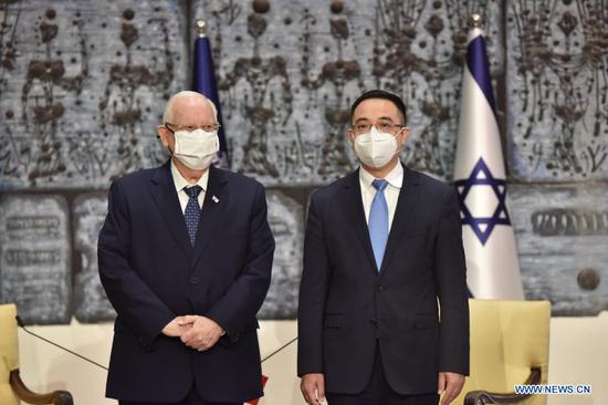Israeli President Reuven Rivlin (L) poses with the new Chinese Ambassador to Israel Cai Run during a credentials presentation ceremony at the president's residence in Jerusalem, on April 21, 2021. Rivlin said at Cai Run's credentials presentation ceremony on Wednesday that Israel is willing to make more efforts to further develop the Israel-China relationship. (Xinhua)