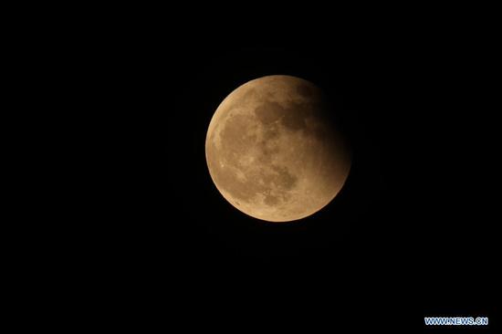 Lunar eclipse is seen above Beijing, capital of China, May 26, 2021. (Xinhua/Xing Guangli)