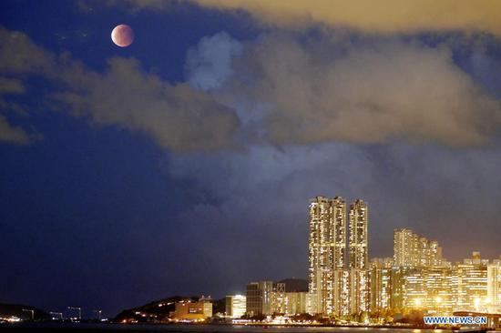 Lunar eclipse is seen above south China's Hong Kong, May 26, 2021. (Xinhua/Wang Shen)