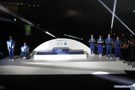 Elements and items including podium, music, costume and medal tray are presented during an unveiling event of the items that will be used for the victory ceremonies of the Tokyo 2020 Olympic and Paralympic Games at Ariake Arena in Tokyo, Japan on June 3, 2021. (Xinhua/Wang Zijiang)