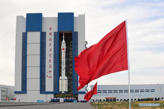 The combination of the Shenzhou-12 manned spaceship and a Long March-2F carrier rocket is being transferred to the launching area of Jiuquan Satellite Launch Center in northwest China, June 9, 2021. The combination of the Shenzhou-12 manned spaceship and a Long March-2F carrier rocket has been transferred to the launching area, the China Manned Space Agency (CMSA) said Wednesday. The facilities and equipment at the launch site are in good condition, and various pre-launch function checks and joint tests will be carried out as planned, said the CMSA. (Photo by Wang Jiangbo/Xinhua)