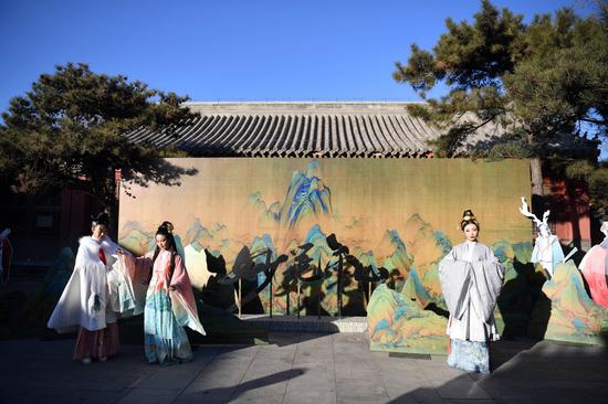 File photo shows models perform during a press conference of a mobile game in the Palace Museum in Beijing, capital of China. (Xinhua/Jin Liangkuai)