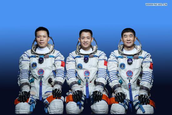 This undated photo shows Chinese astronauts Nie Haisheng (C), Liu Boming (R) and Tang Hongbo who will carry out the Shenzhou-12 manned spaceflight mission. (Photo by Xu Bu/Xinhua)