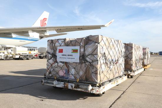 Medical supplies donated by China are unloaded from a plane at Robert Mugabe International Airport in Harare, Zimbabwe, on May 11, 2020. (Xinhua/Zhang Yuliang)
