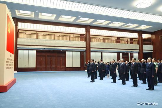 Xi Jinping leads other Communist Party of China (CPC) and state leaders Li Keqiang, Li Zhanshu, Wang Yang, Wang Huning, Zhao Leji, Han Zheng and Wang Qishan to review the Party admission oath after visiting an exhibition on CPC history themed 