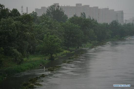 Hiking trails are flooded during a rainfall near Liangshui River in Daxing District of Beijing, capital of China, July 12, 2021. Heavy rainstorm has lashed the Chinese capital Beijing since 6 p.m. Sunday with precipitation up to 116.4 mm, according to the municipal flood control department. From 6 p.m. Sunday to 9 a.m. Monday, Beijing registered average rainfall of 65.9 mm. Urban areas of the city reported higher average precipitation of 79.9 mm. (Xinhua/Peng Ziyang)