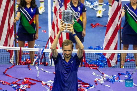 Daniil Medvedev of Russia lifts the trophy after the men's singles final between Novak Djokovic of Serbia and Daniil Medvedev of Russia at the 2021 US Open in New York, the United States, Sept. 12, 2021. (Photo by Michael Nagle/Xinhua)