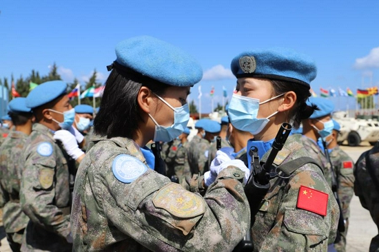 Soldiers on the Chinese contingent to the United Nations Interim Force in Lebanon (UNIFIL) are awarded the United Nations Peacekeeping Medal during a medal parade ceremony in southern Lebanon, June 16, 2021. (Photo by Liu Xiongma/Xinhua)