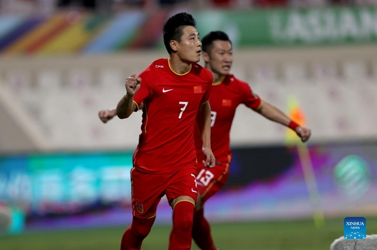 Wu Lei (L) of China celebrates during a Group B match between China and Australia of 2022 FIFA World Cup Asian qualifiers in Sharjah, the United Arab Emirates, on Nov. 16, 2021. (Xinhua)