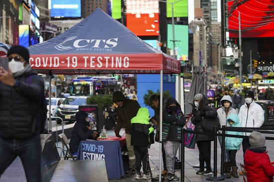 People wait for COVID-19 tests on Times Square in New York, the United States, Nov. 23, 2021. (Xinhua/Wang Ying)