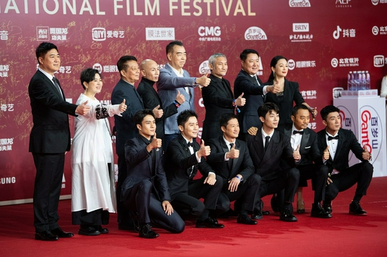 Cast members of the film the Battle at Lake Changjin pose for a group photo on the red carpet for the 11th Beijing International Film Festival in Beijing, capital of China, Sept. 20, 2021. (Xinhua/Chen Zhonghao)