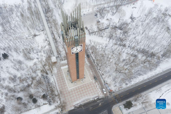Aerial photo taken on Jan. 8, 2022 shows a short track speed skating memorial hall which opened in 2019 to present local skating history in Qitaihe City, northeast China's Heilongjiang Province. To date, six of China's 13 Winter Olympic gold medals have been claimed by athletes trained in Qitaihe City. The city has been stepping up efforts to train winter sports talents in recent years by building schools that teach short track speed skating, setting up training base for provincial sports team, as well as holding ice and snow sports events. (Xinhua/Xie Jianfei)