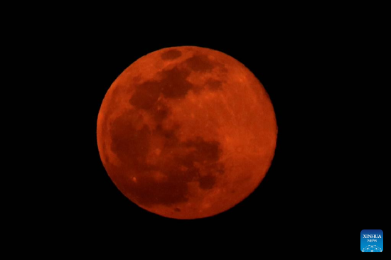Photo taken on Feb. 16, 2022 shows a full moon over Aqaba, Jordan. (Photo by Mohammad Abu Ghosh/Xinhua)