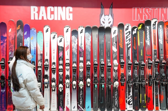 A staff member arranges skis at sports brand Nordica store in Beijing, capital of China, Jan. 6, 2022.(Xinhua/Chen Zhonghao)