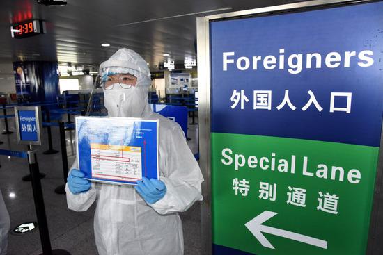 China guards against imported cases as overseas COVID-19 infections soar