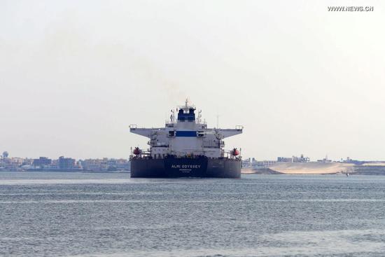 Photo taken on March 30, 2021 shows a ship sailing on the Suez Canal, Egypt. At least 113 container ships have passed through the Suez Canal that was blocked by a massive cargo container, chairman of the Suez Canal Authority (SCA) Osama Rabie said on Tuesday. (Xinhua/Ahmed Gomaa)