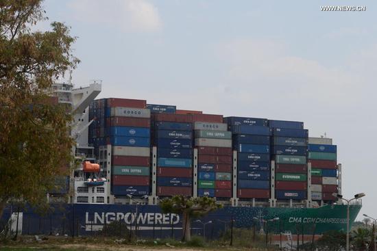 Photo taken on March 30, 2021 shows a ship sailing on the Suez Canal, Egypt. At least 113 container ships have passed through the Suez Canal that was blocked by a massive cargo container, chairman of the Suez Canal Authority (SCA) Osama Rabie said on Tuesday. (Xinhua/Ahmed Gomaa)