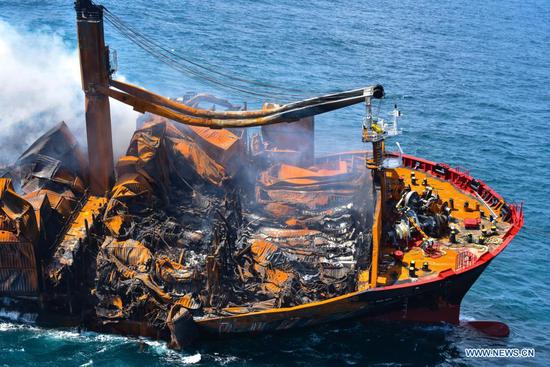 Photo taken on June 2, 2021 shows part of the X Press Pearl, a container ship burnt near the Colombo Port, in Colombo, Sri Lanka. The Sri Lankan Navy on Wednesday said that operations to tow the burnt X Press Pearl ship had been halted after the rear end of the vessel had hit the sea bed. (Sri Lanka Air Force Media/Handout via Xinhua)