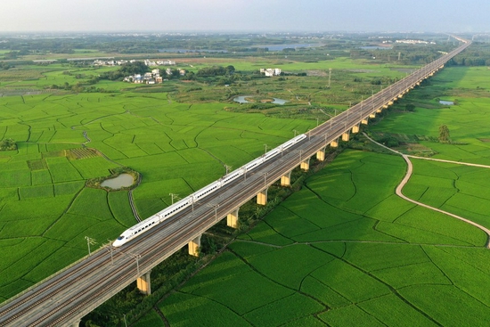 Aerial photo taken on Sept. 19, 2021 shows a high-speed train running over rice fields in Gula Townhip of Binyang County, south China's Guangxi Zhuang Autonomous Region. (Xinhua/Huang Xiaobang)