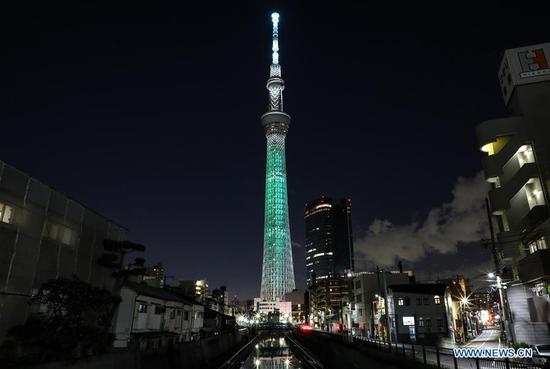 Tokyo Skytree is illuminated with a color symbolizing one of the Sustainable Development Goals (SDGs), as a part of a lighting pattern specially designed in the 17 colors of SDGs in Tokyo, Japan, Oct. 24, 2020. This special illumination of Skytree, designed to boost momentum toward achieving SDGs and to commemorate the 75th anniversary of the UN, will continue till Oct. 28, 2020. (Photo by Lyu Tianze/Xinhua) 