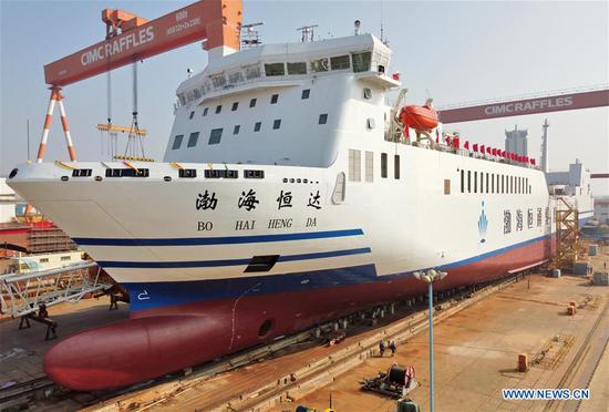 The multipurpose ro-ro ship "Bohai Hengda" is seen launched into the water in Longkou construction base of CIMC Raffles in Yantai, east China's Shandong Province, Oct. 19, 2020. In the first three quarters, China's GDP expanded 0.7 percent year on year, returning to growth after the 1.6-percent contraction in the first half of the year and the 6.8-percent slump in Q1, according to the National Bureau of Statistics (NBS). (Photo by Tang Ke/Xinhua)