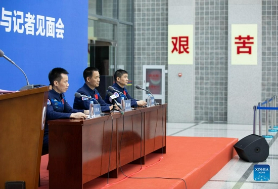 Chinese astronauts Tang Hongbo (L), Nie Haisheng (C) and Liu Boming attend a press conference held by the China Astronaut Research and Training Center in Beijing, capital of China, Dec. 7, 2021. Tang Hongbo, Nie Haisheng and Liu Boming, the three astronauts of the Shenzhou-12 spaceflight mission, on Tuesday met with the public and the press here for the first time after their return to Earth. (Xinhua/Jin Liwang)