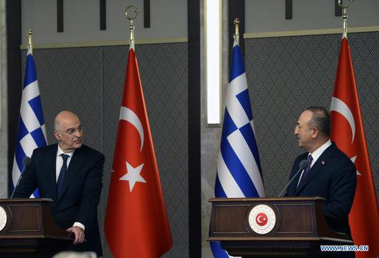 Turkish Foreign Minister Mevlut Cavusoglu (R) and Greek Foreign Minister Nikos Dendias attend a joint press conference in Ankara, Turkey, on April 15, 2021. Turkey believes that its issues with Greece can be resolved through constructive dialogue between the two neighbors and allies, Turkish Foreign Minister Mevlut Cavusoglu said Thursday. (Photo by Mustafa Kaya/Xinhua)