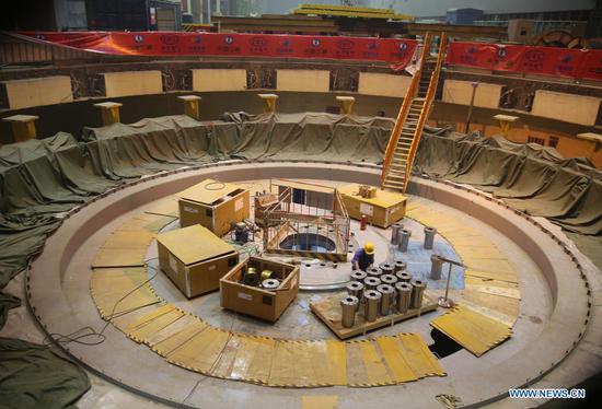 Workers are busy at the construction site of the Baihetan hydropower station in southwest China, April 27, 2021. Construction of the Baihetan hydropower station in southwest China is proceeding smoothly. With a total of 16 homegrown million-kilowatt generating units, Baihetan hydropower station, located on the Jinsha River, the upper section of the Yangtze, straddling Yunnan and Sichuan provinces, is the second-largest in China after the Three Gorges Dam project in the central province of Hubei in terms of installed capacity. (Photo by Liang Zhiqiang/Xinhua)