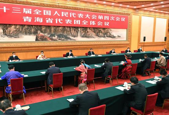 Chinese President Xi Jinping, also general secretary of the Communist Party of China Central Committee and chairman of the Central Military Commission, takes part in a deliberation with lawmakers from Qinghai Province, at the fourth session of the 13th National People's Congress in Beijing, capital of China, March 7, 2021. (Xinhua/Li Tao)